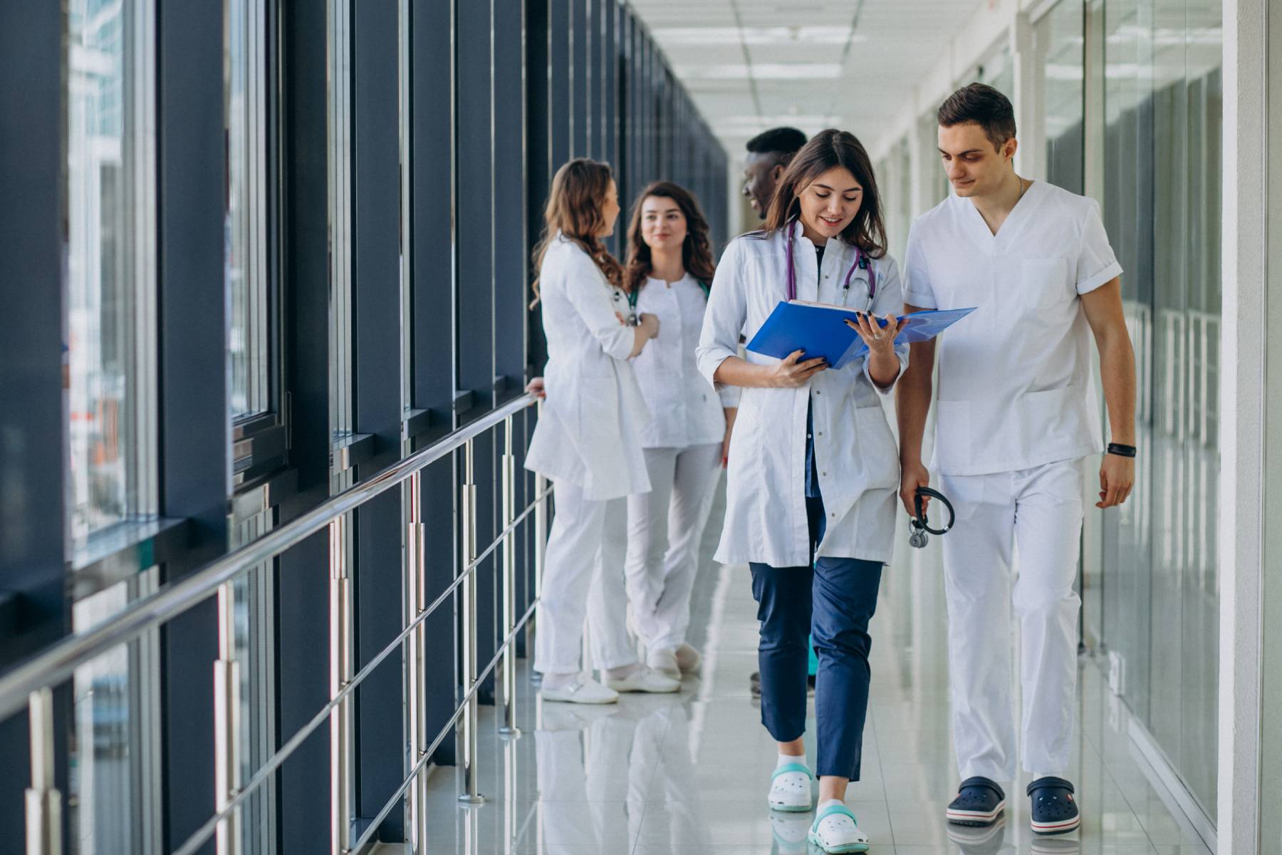 team-young-specialist-doctors-standing-corridor-hospital (1)
